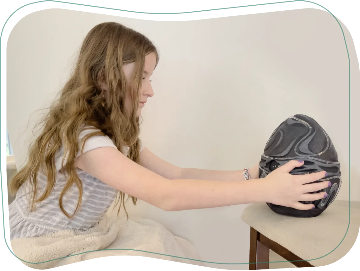 The child places the egg in a special base and waits for the egg to hatch in the pre-op room.